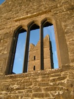 Looking through a church window toward the tower at Moyne Abbey, Co. Mayo